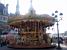 A merry-go-round in front of the Hôtel de Ville (727x)