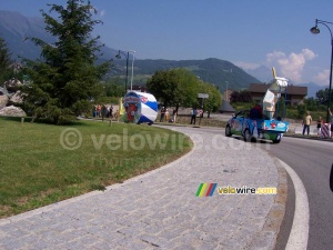 The La Vache Qui Rit packaging and one of the cars on a roundabout - [1 day in the La Vache Qui Rit 'caravane'] (787x)