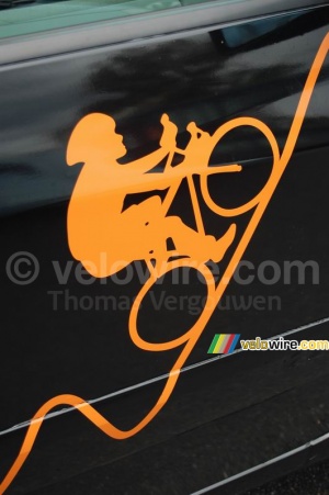 The Orange cyclist on one of the cars (463x)