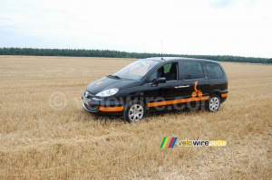 A Orange car in the middle of a big field! (581x)